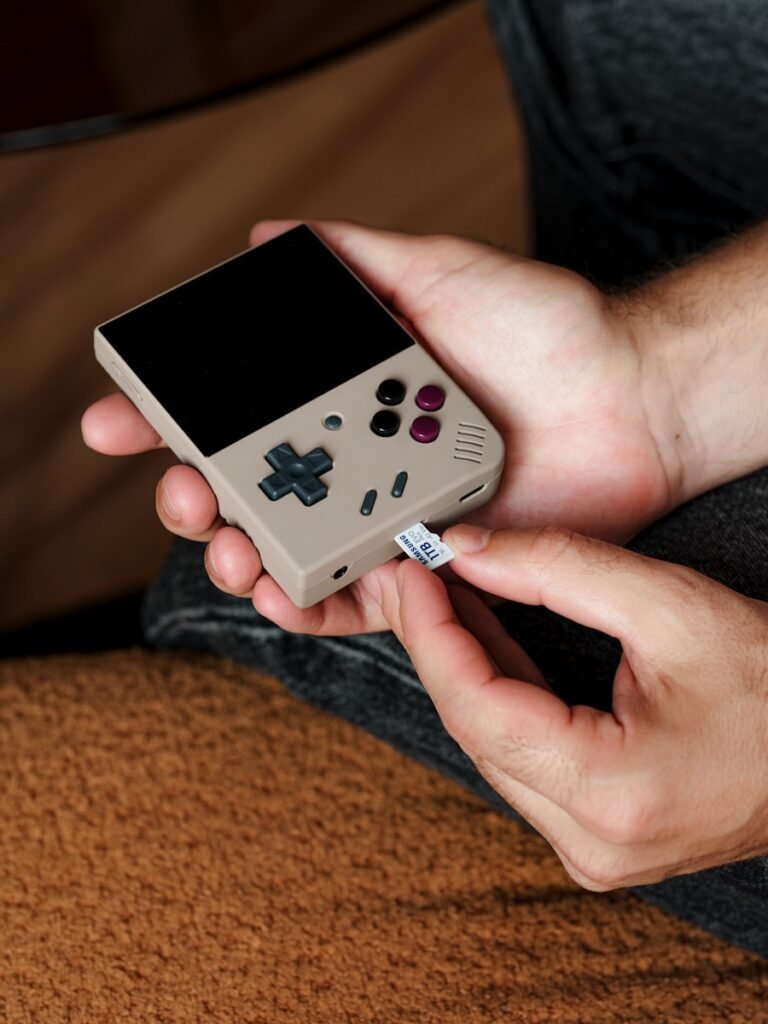 A person holding a nintendo wii game controller